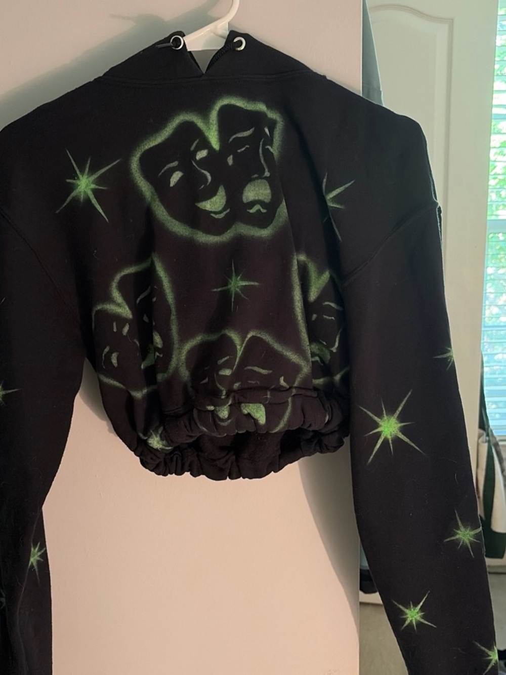 Black Hoodie with Neon Green Theatrical Print - Women’s Sweatshirt